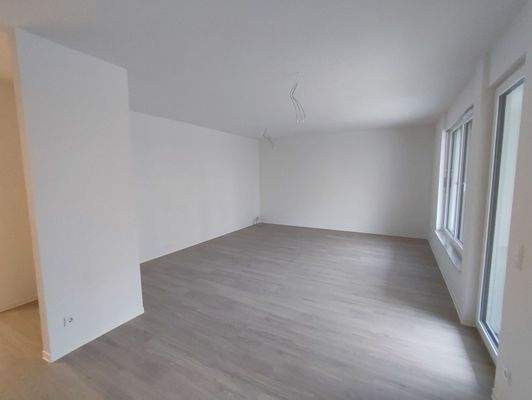 Wohnzimmer mit Zugang zur Terrasse