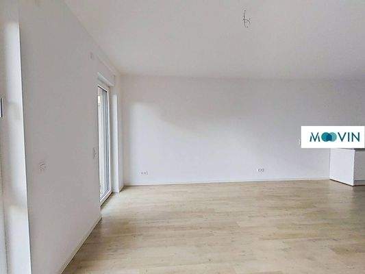 Ansicht III: Wohn - und Esszimmer mit offener Küche