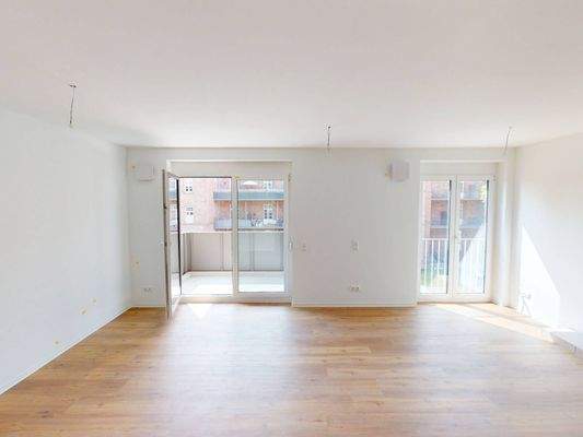 Ansicht I: Wohn- und Esszimmer mit offenem Küchenbereich