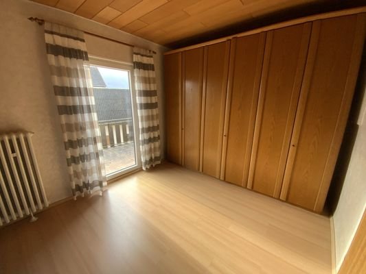 Schlafzimmer mit Balkonzugang