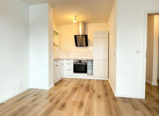 Wohnzimmer mit offener Küche