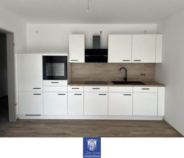 Wohlfühlwohnung mit Terrasse und moderner Ausstattung im Erstbezug! Rollstuhlgerecht! - Foto 1