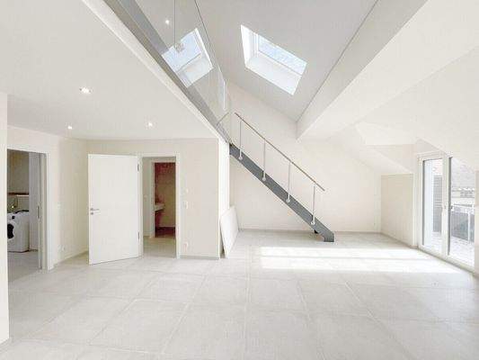 Wohnbereich mit Aufgang zur Galerie