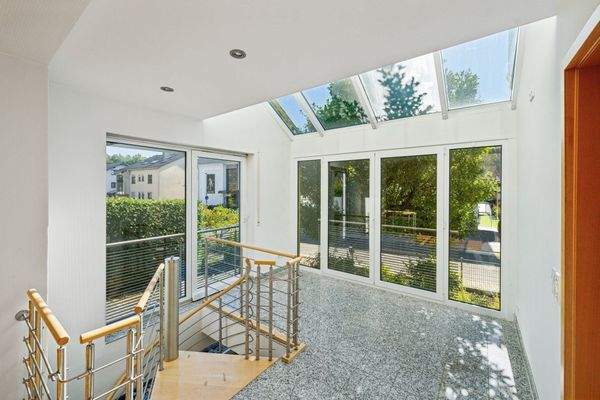 Wintergarten im Erdgeschoss mit Zugang zum Untergeschoss