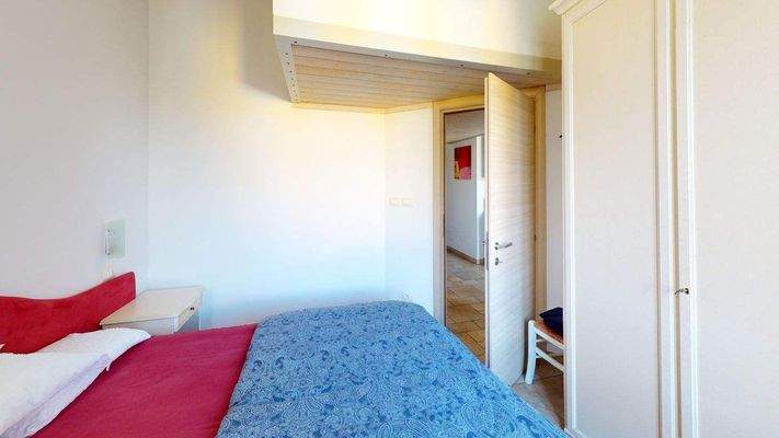 AM-056-Bilocale-in-residence-con-piscina-Bedroom.j