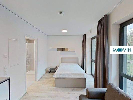 Ansicht I: Wohn- und Schlafzimmer mit offenem Küchenbereich