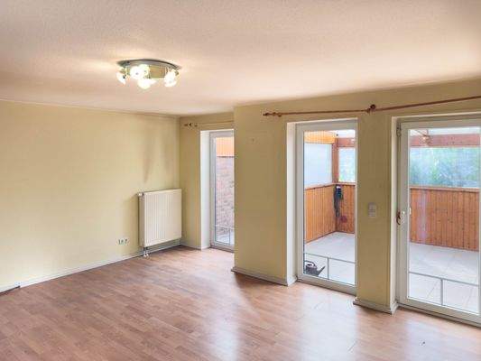 Wohnzimmer mit Zugang zum Wintergarten