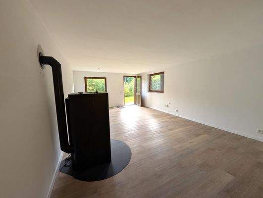 Wohnzimmer mit Kamin UG