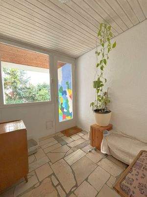 Wintergarten mit Zugang zum Hof