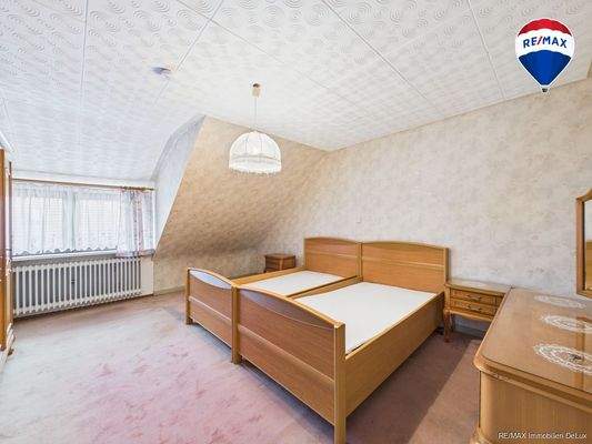 RE/MAX Immobilien DeLux Einfamilienhaus Körprich Schlafzimmer