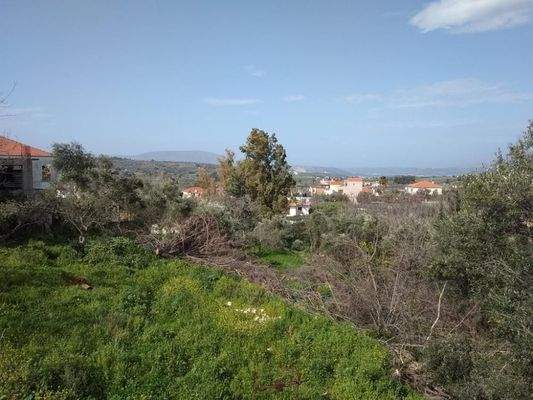 Grundstück im Dorf Vamos mit Meerblick
