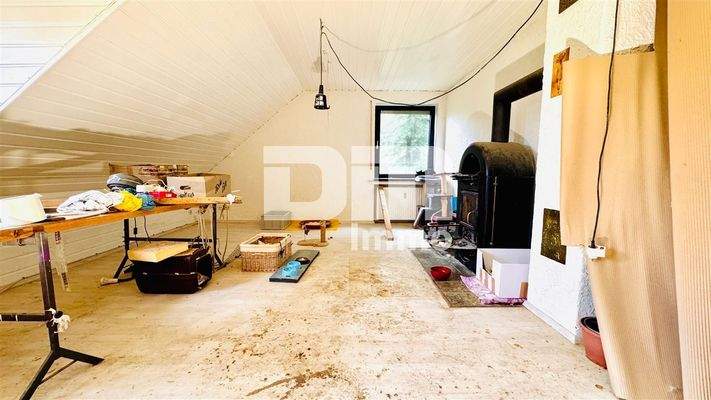 WE2 OG / DG Wohnzimmer / Kamin