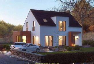 Dieses massa haus Fertighaus Einfamilienhaus im Lifestyle-Design präsentiert sich bei Abenddämmerung