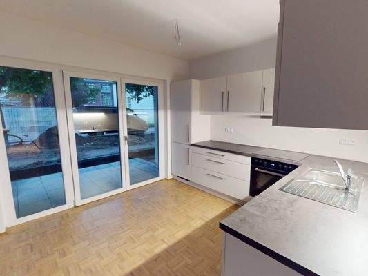 Ansicht II: Wohn- und Esszimmer mit Zugang zur Terrasse