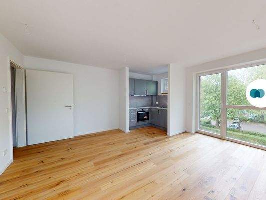 Ansicht IV: Wohn- und Esszimmer mit offenem Küchenbereich