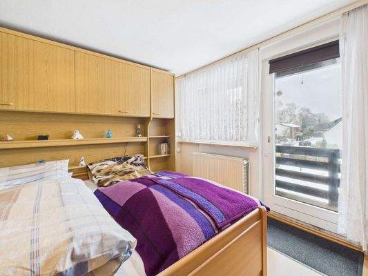 Schlafzimmer mit Balkonzugang