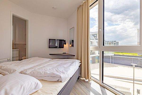 Schlafzimmer mit angrenzendem Duschbad en Suite