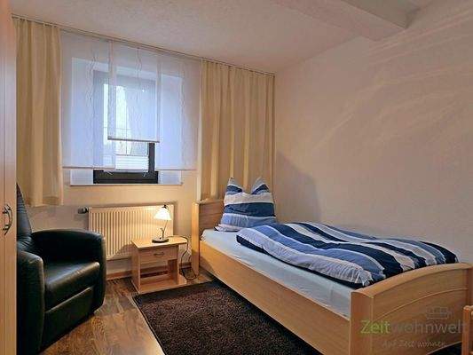 Schlafzimmer mit Sessel