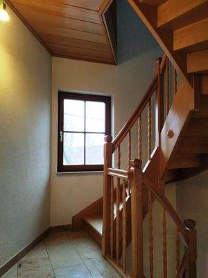 Treppenhaus mit Holztreppe