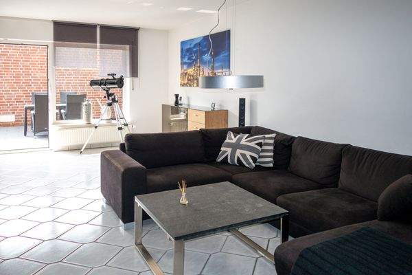 Wohnzimmer mit Zugang zum Garten