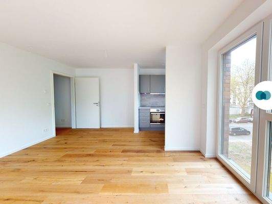 Ansicht III: Wohn- und Esszimmer mit offenem Küchenbereich