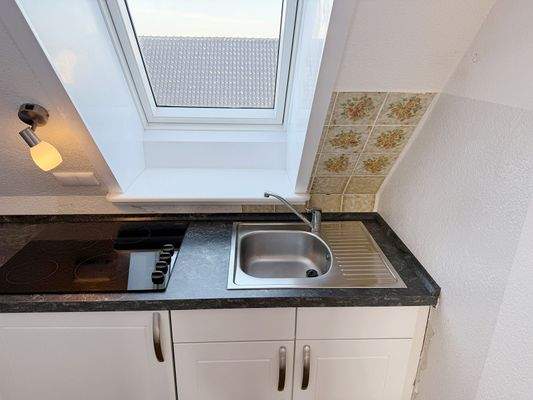 ... mit einer Einbauküche