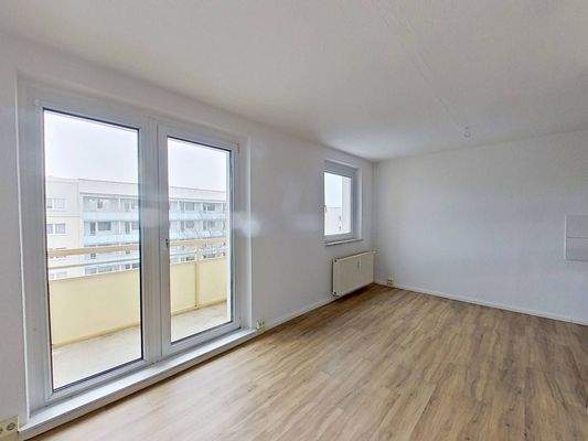 Ansicht I: Wohn- und Esszimmer mit offenem Küchenbereich