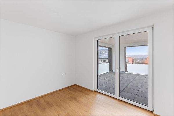 Schlafzimmer mit Zugang zur Terrasse