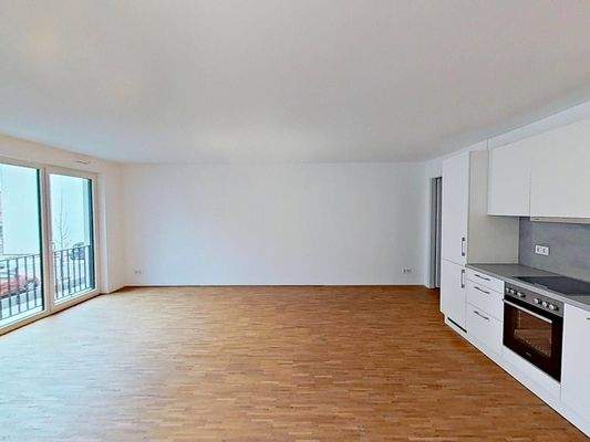 Ansicht III: Wohn- und Esszimmer mit offenem Küchenbereich