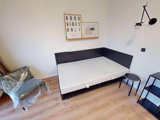 Ansicht IV: Wohn- und Schlafzimmer mit offenem Küchenbereich