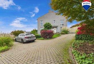 RE/MAX Immobilien DeLux Einfamilienhaus Mettlach-Weiten Außenansicht