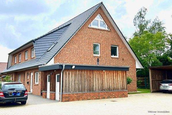 Hausansicht mit Abstellräumen