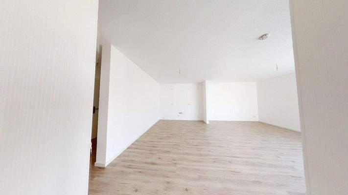 Wohnzimmer mit offener Küche