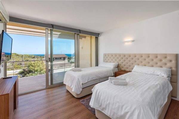 Schlafzimmer 2 mit Bad en Suite und Balkon