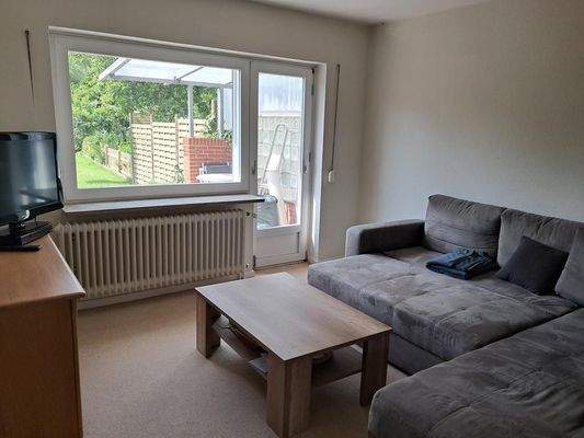 Wohnzimmer mit Gartenzugang