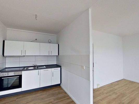 Ansicht IV: Wohn- und Esszimmer mit offenem Küchenbereich