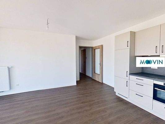 Ansicht V: Wohn- und Esszimmer mit offenem Küchenbereich