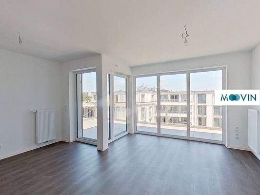 Ansicht II: Wohn- und Esszimmer mit offenem Küchenbereich