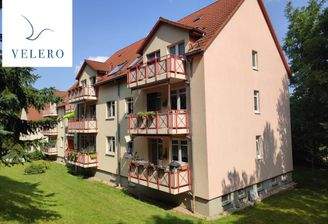 Hausansicht mit Logo