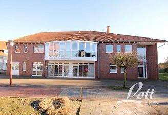 2) Wohn- und Geschäftshaus