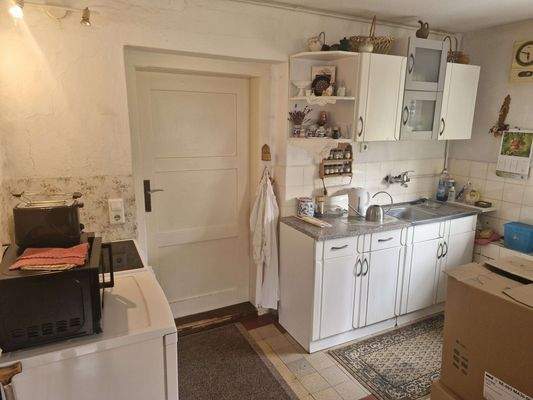 Wohnzimmer mit Küche im EG