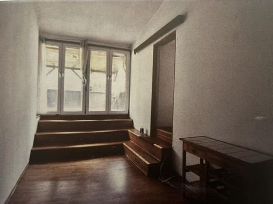 Wohnzimmer mit Zugang zur Terrasse