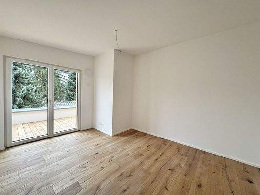 Schlafzimmer mit Zugang zur Dachterrasse