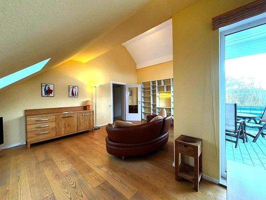 Living and dining room with access to balcony