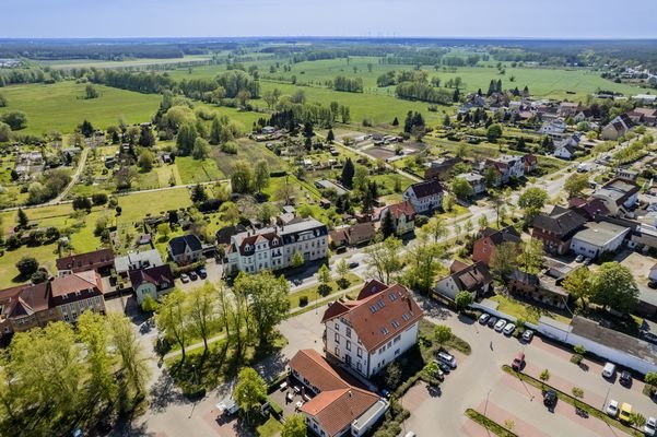 Aerial view of the property with a view of the sur