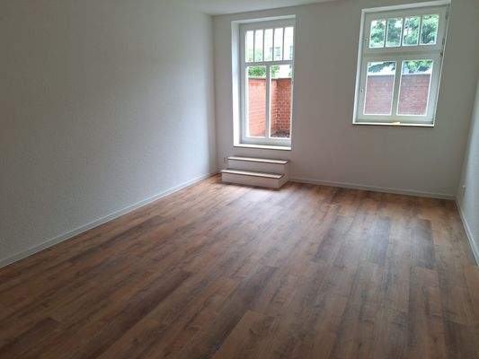 Wohnzimmer mit Zugang Terrasse