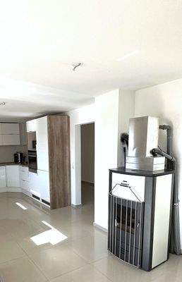 Moderner Ofen im Wohn-Essbereich EG