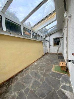 Wintergarten mit Zugsang zum Garten