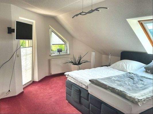 Schlafzimmer mit Balkon
