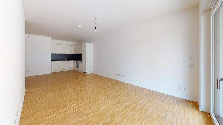 Wohnbereich mit offener Küche Muster